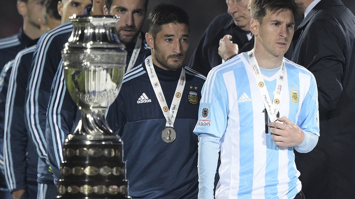 Lionel Messi's trophyless streak with Argentina continued with the 2015 Copa América loss to Chile. (Photo by JUAN MABROMATA/AFP via Getty Images)