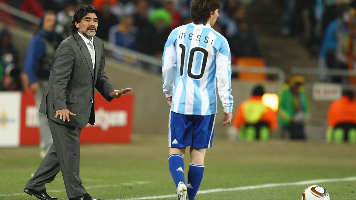 From one ‘El Diez’ to another. Argentina coach Diego Maradona looks on as Lionel Messi plays at the 2010 World Cup. (Photo by Richard Heathcote/Getty Images)