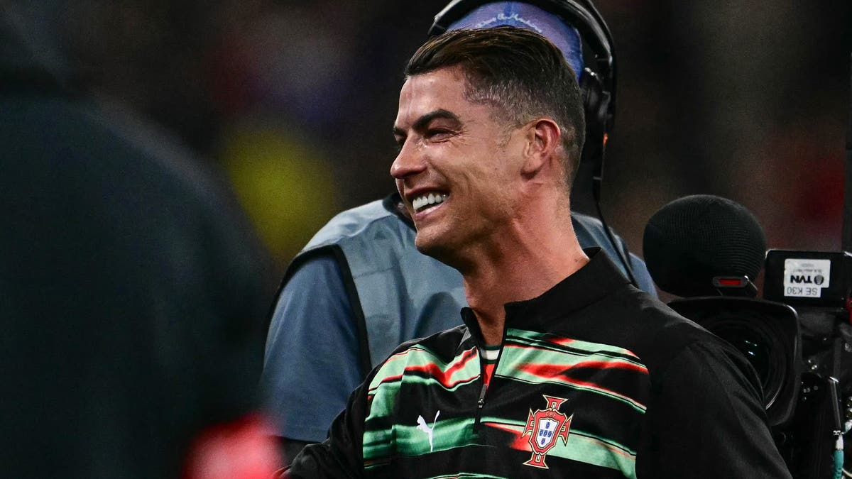 Cristiano Ronaldo had to watch Portugal beat Spain on penalties from the sideline after an injury ended his night early. (Photo by Tobias SCHWARZ / AFP) (Photo by TOBIAS SCHWARZ/AFP via Getty Images)