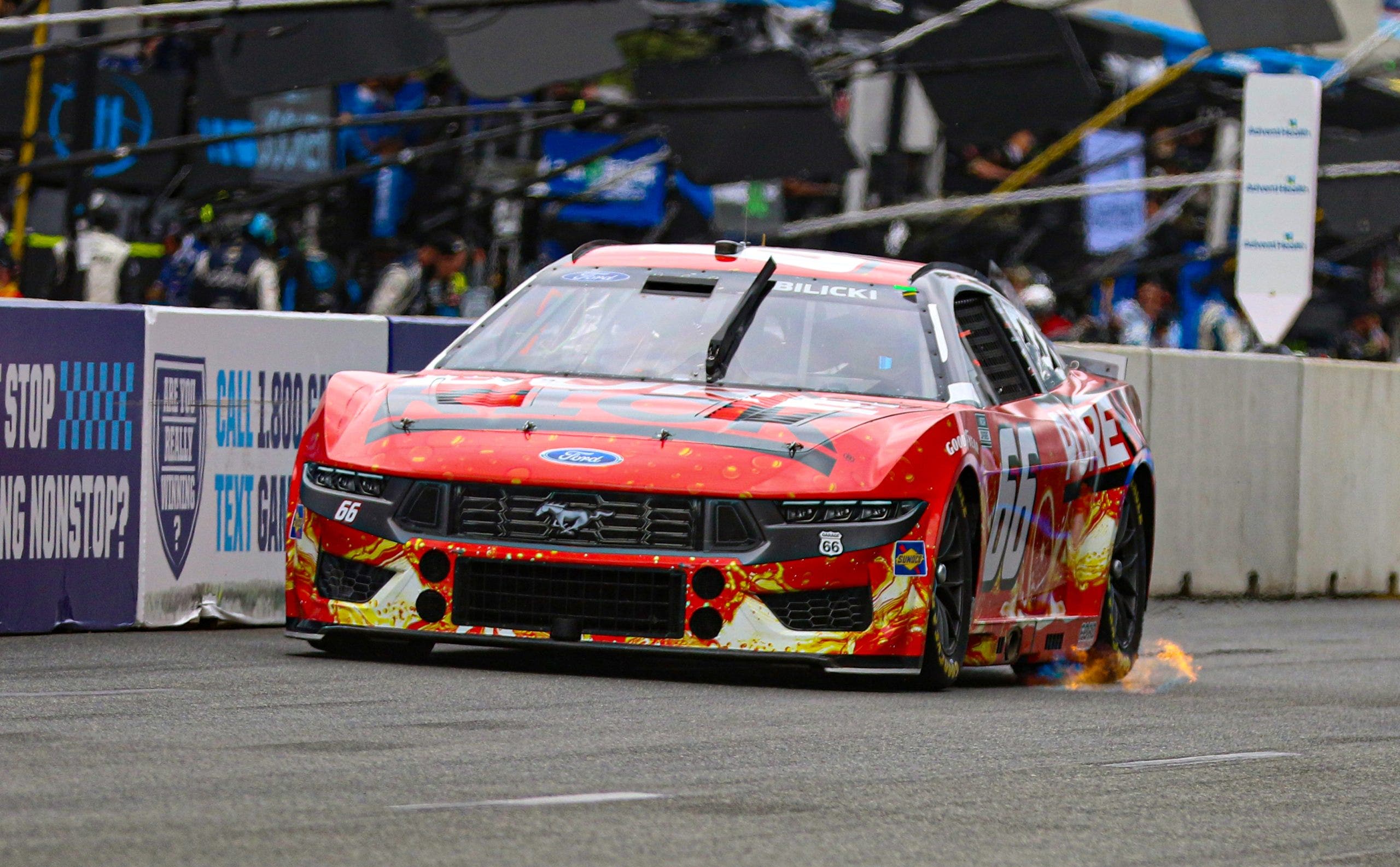 After experiencing an electrical fire under the dash during the final stage of Saturday's Xfinity race, Josh Bilicki (No. 66) came out firing on Sunday. Later in the race, his car suffered heavy nose damage, but he still finished 21st, his best on a road course. (Photo by Ed McGregor/FOX Sports)