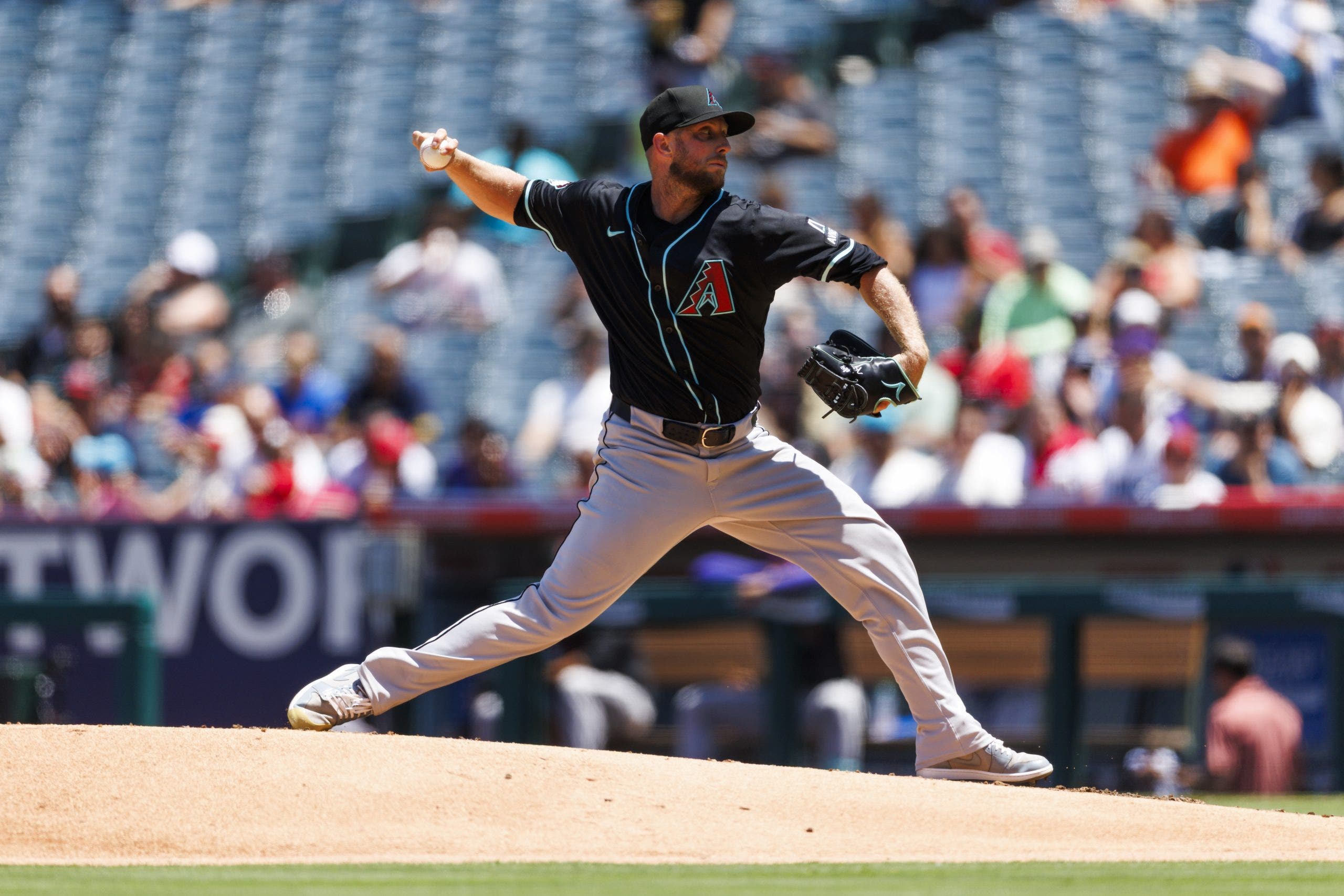 Merrill Kelly bolsters the Rangers' rotation for the rest of the season. (Photo by Ric Tapia/Getty Images)