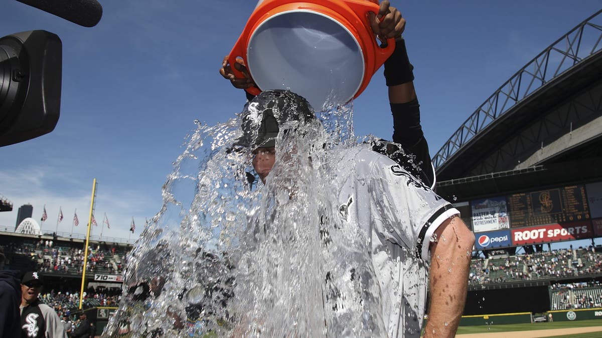 Philip Humber was doused with water after throwing his perfect game. (Photo by Otto Greule Jr/Getty Images)