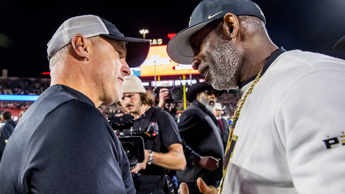 Deion Sanders joked about Texas Tech's Joey McGuire (left) at Big 12 Media Days on Wednesday. (Photo by John E. Moore III/Getty Images)