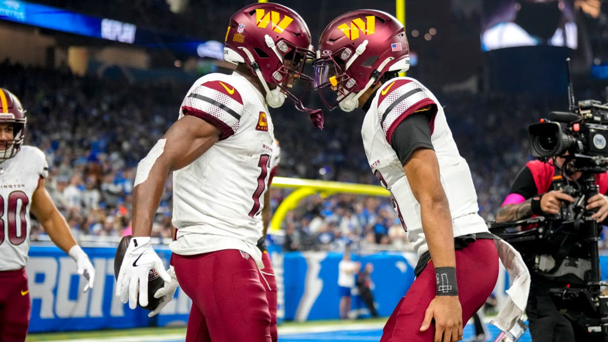 Terry McLaurin was second in the NFL with a career-high 13 touchdown catches in his first season playing with QB Jayden Daniels (right). (Photo by Nic Antaya/Getty Images)
