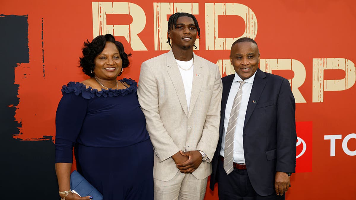 In April, Ward attended the draft at Lambeau Field with his parents, Patrice and Calvin Ward. (Photo by Michael Reaves/Getty Images)