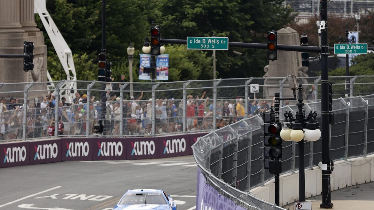 Ricky Stenhouse Jr., driver of the #47 Rate Chevrolet, and Cody Ware, driver of the #51 Arby's New Angus Cheesesteak Ford, race during the NASCAR Cup Series Grant Park 165 at Chicago Street Course