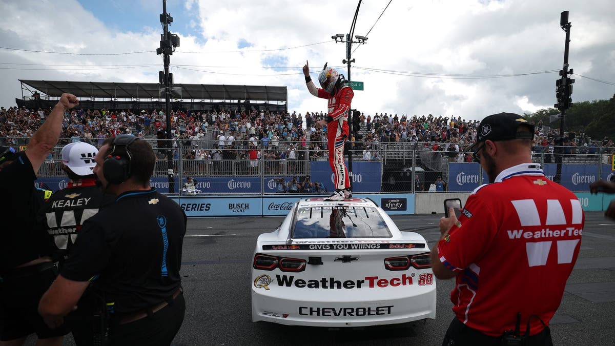 Shane van Gisbergen and crew celebrate after winning the NASCAR Cup Series Grant Park 165 