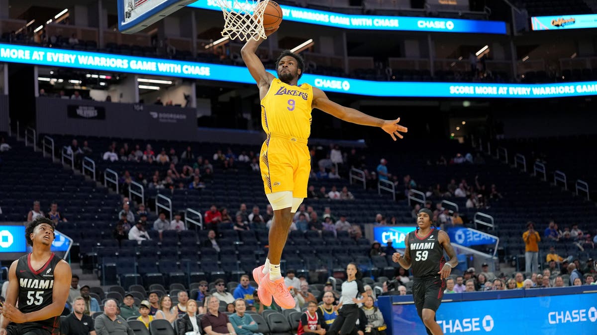 Bronny James goes in for a slam dunk against the Miami Heat during the first half of the California Classic.