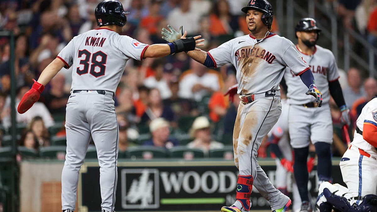 Steven Kwan #38 of the Cleveland Guardians congratulates Jose Ramirez #11 after a three-run home run against the Houston Astros at Daikin Park on July 07, 2025 in Houston. (Photo by Tim Warner/Getty Images)
