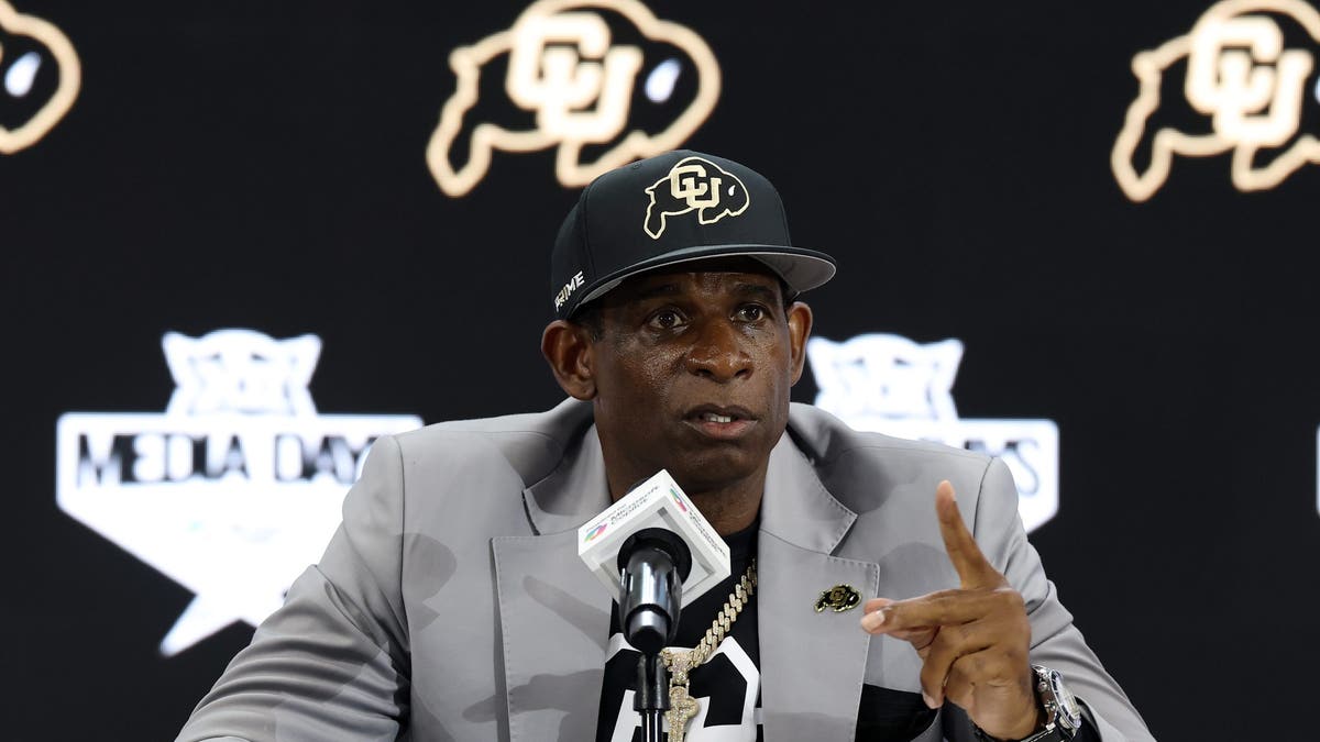 Head coach Deion Sanders of the Colorado Buffaloes speaks with the media during the Big 12 Media Days. (Photo by Stacy Revere/Getty Images)