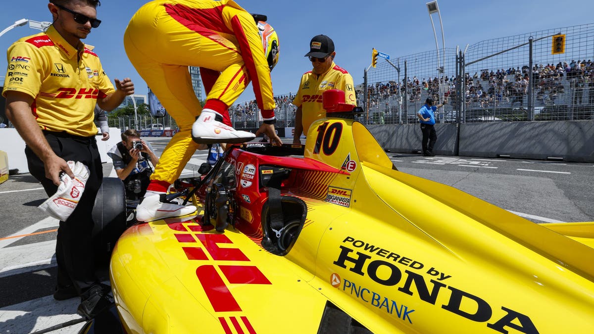 Alex Palou climbs into his ride during race weekend at Ontario?