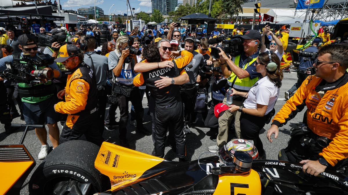Zak Brown and Pato O'Ward embrace after the Ontario Honda Dealers Indy Toronto?