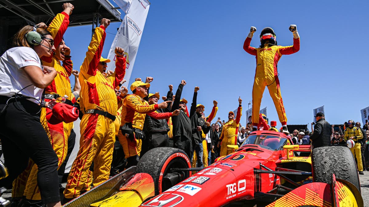 Alex Palou celebrates after winning the NTT INDYCAR Series Java House Grand Prix of Monterey at WeatherTech Raceway Laguna Seca