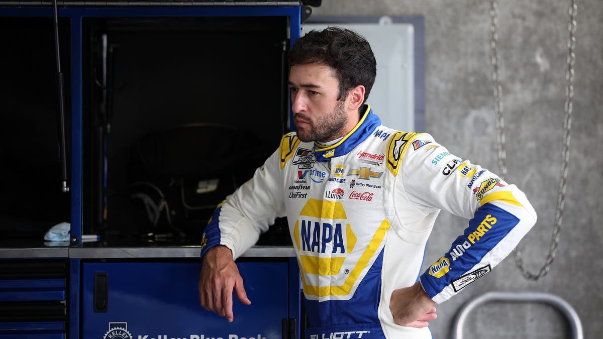 Chase Elliott waits in the garage area during practice for the NASCAR Cup Series Brickyard 400