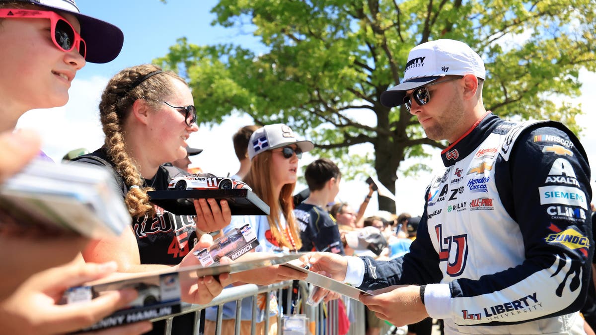 William Byron signs autographs for NASCAR fans prior to the NASCAR Cup Series Brickyard 400