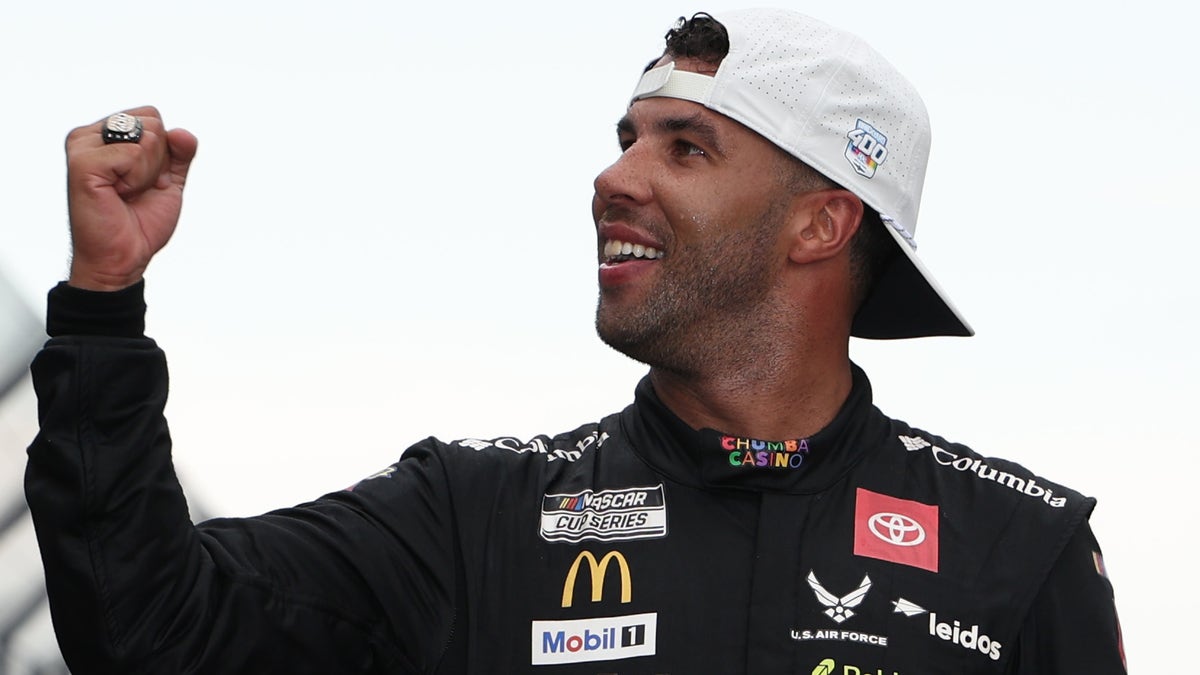 Bubba Wallace celebrates at the yard of bricks after winning the NASCAR Cup Series Brickyard 400