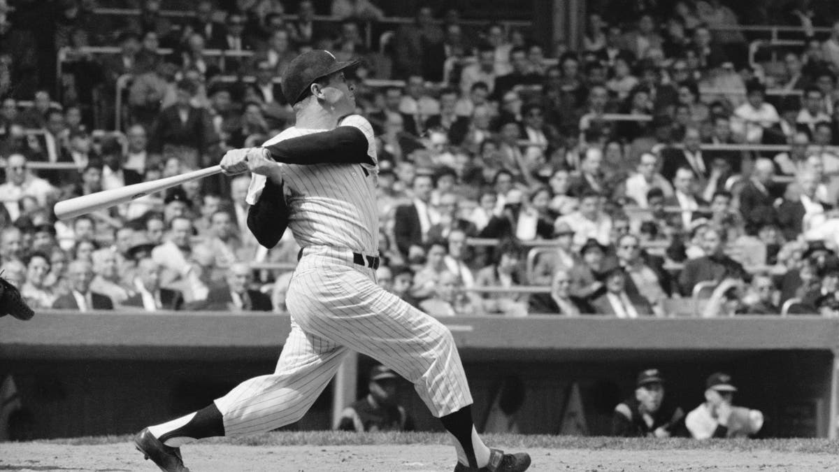 4/24/1960-New York, NY: Mickey Mantle of the New York Yankees, batting during a game against Baltimore at Yankee Stadium.