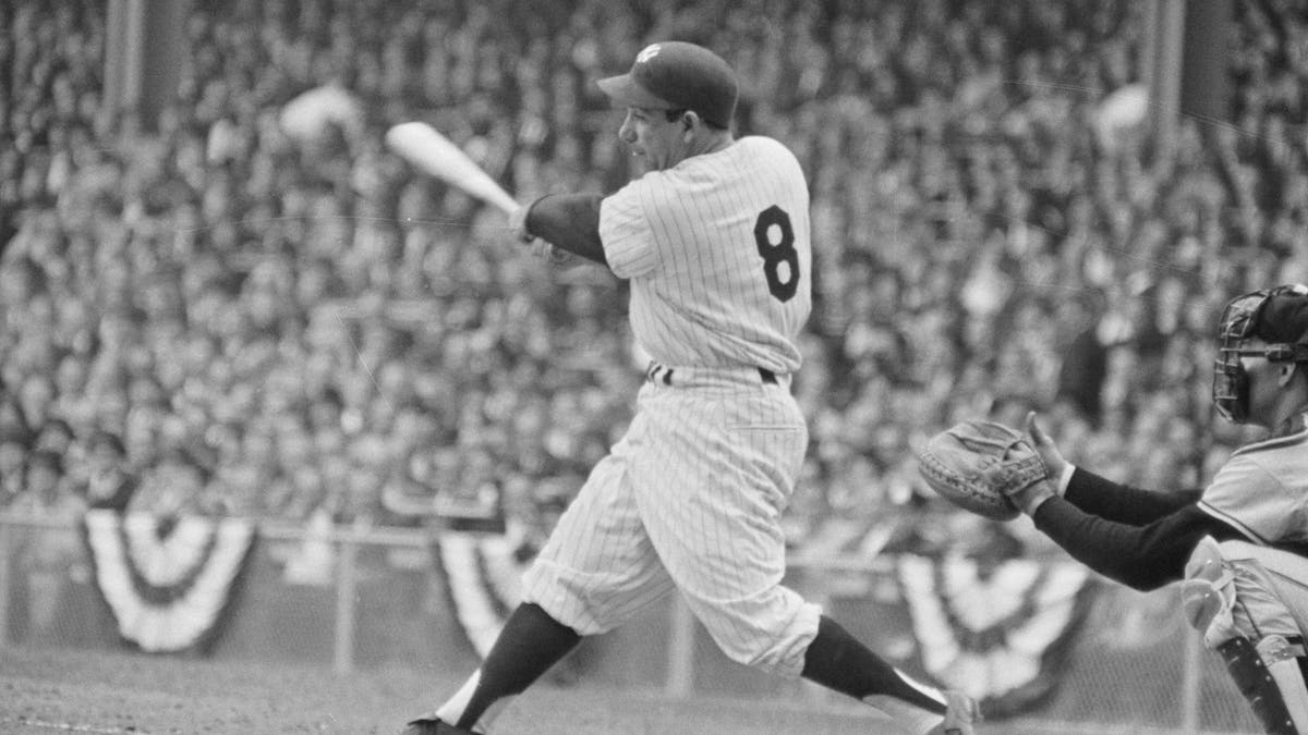 New York Yankee Yogi Berra batting during the 4th World Series game against the San Francisco Giants. (via Getty)