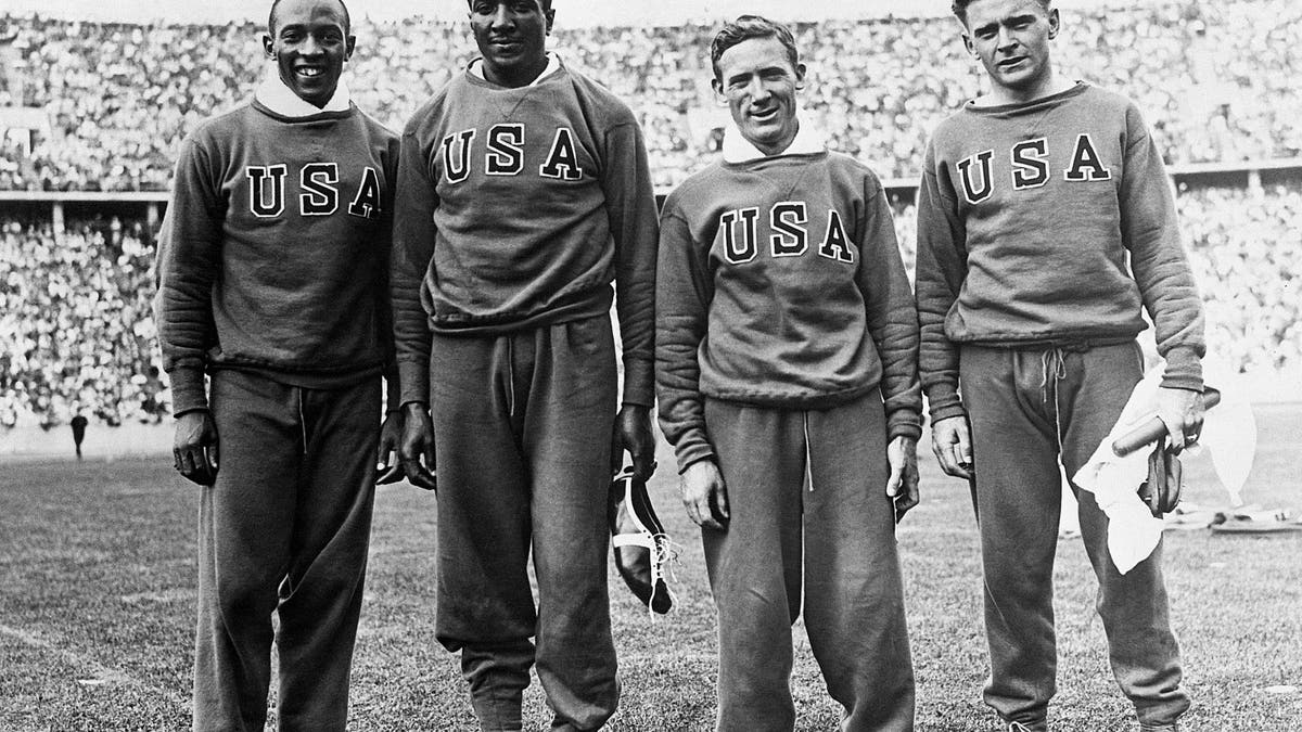 Pictured above are the members of the American relay team, which won the 400-meter relay race at the Olympics in Berlin. They bettered the world and the Olympic records at 0:39.8. From left to right: Jesse Owens, Ralph Metcalfe, Foy Draper, and Frank Wykoff. (via Getty Images)