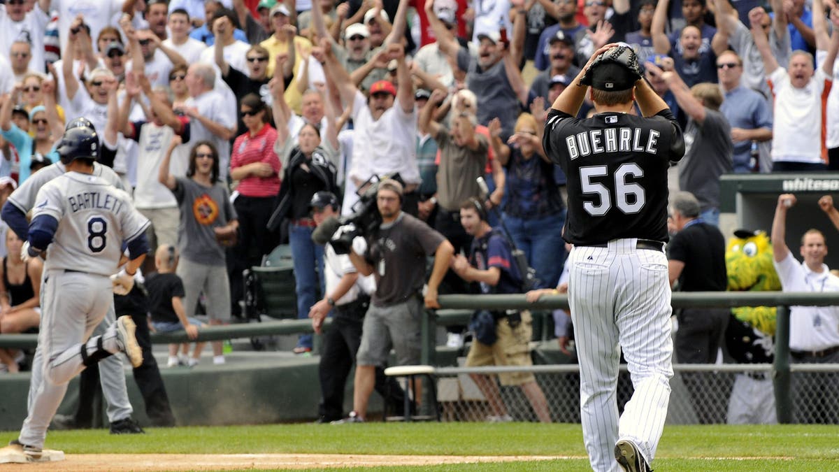 Mark Buerhle was in disbelief after throwing a perfect game in 2009. (Photo by Warren Wimmer/Icon SMI/Corbis/Icon Sportswire via Getty Images)