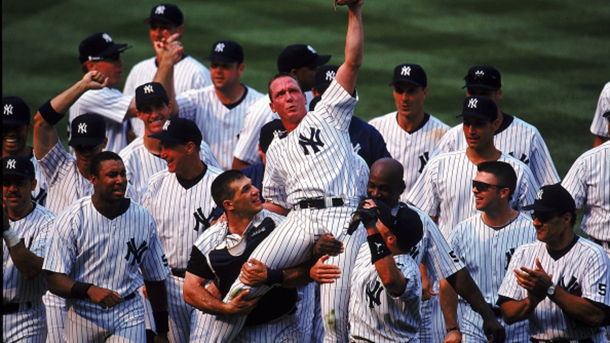 David Cone was also carried off the field by his Yankees teammates after throwing his perfect game in 1999. Credit: (Vincent Laforet /Allsport)