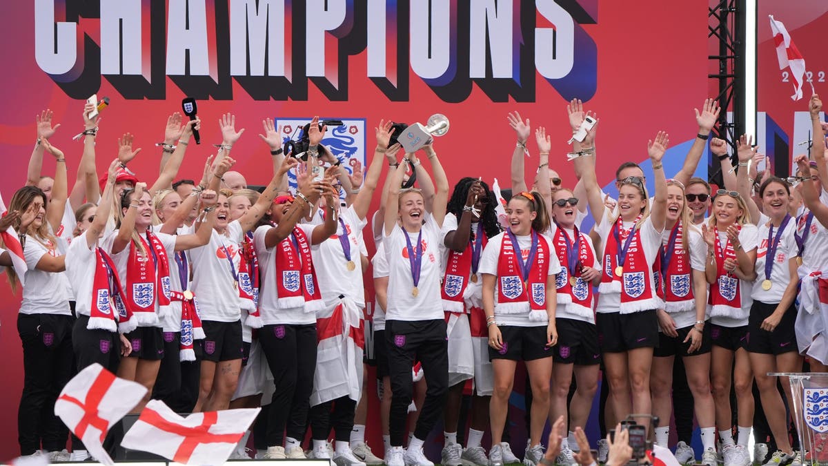 England's Leah Williamson lifts the Euro trophy as she celebrates. (Photo by Gareth Fuller/PA Images via Getty Images)