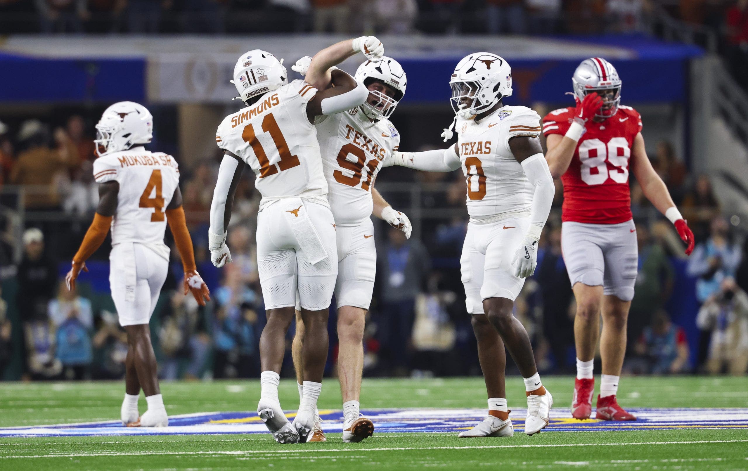 Colin Simmons #11 of Texas celebrates during a game against Ohio State. (Photo by CFP/Getty Images)