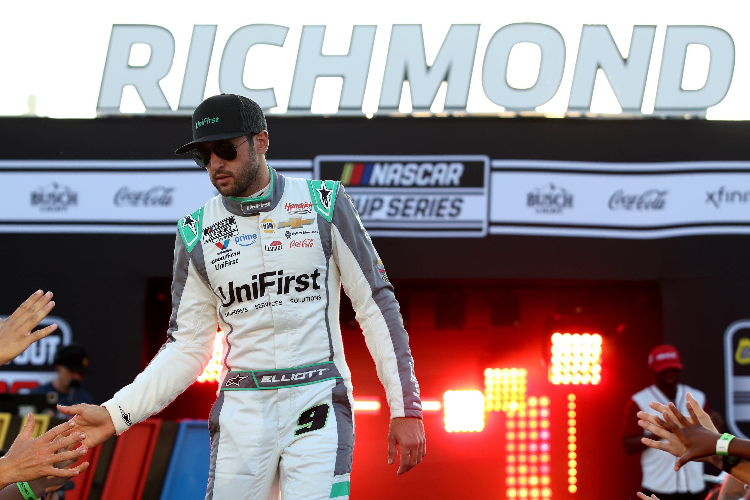 Chase Elliott greets fans as he walks on stage during driver intros prior to the NASCAR Cup Series Cook Out 400 at Richmond Raceway