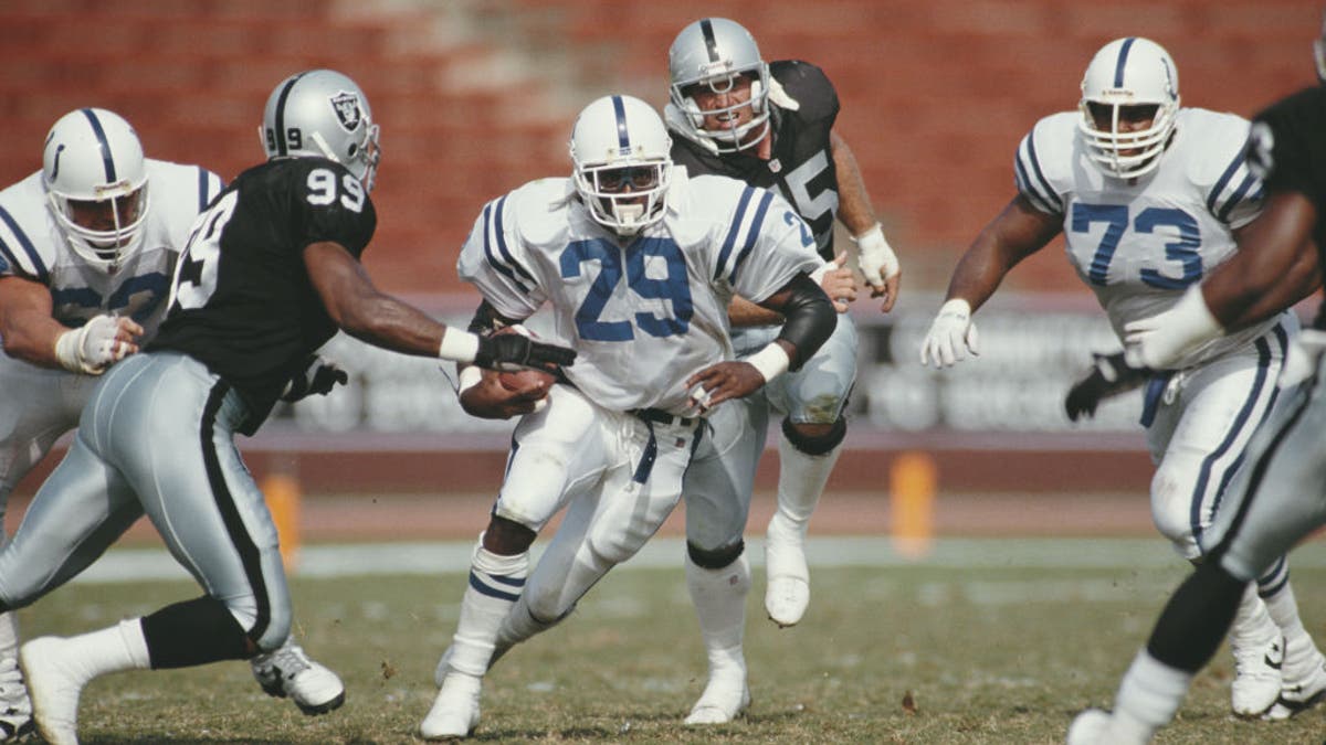 Eric Dickerson holds the NFL's single-season rushing yards record. (Photo by Stephen Dunn/Allsport/Getty Images)