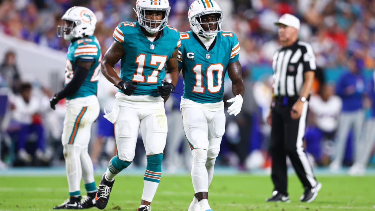 Jaylen Waddle #17 and Tyreek Hill #10 of the Miami Dolphins looks on during the first quarter of the game against the Buffalo Bills at Hard Rock Stadium on September 12, 2024 in Miami Gardens, Florida. (Photo by Megan Briggs/Getty Images)