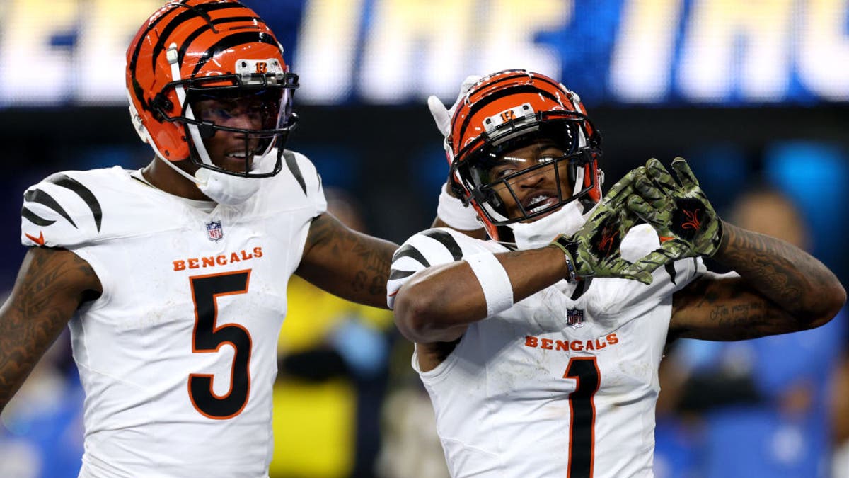 Ja'Marr Chase #1 of the Cincinnati Bengals celebrates his touchdown with Tee Higgins #5 during a 34-27 loss to the Los Angeles Chargers at SoFi Stadium on November 17, 2024 in Inglewood, California. (Photo by Harry How/Getty Images)