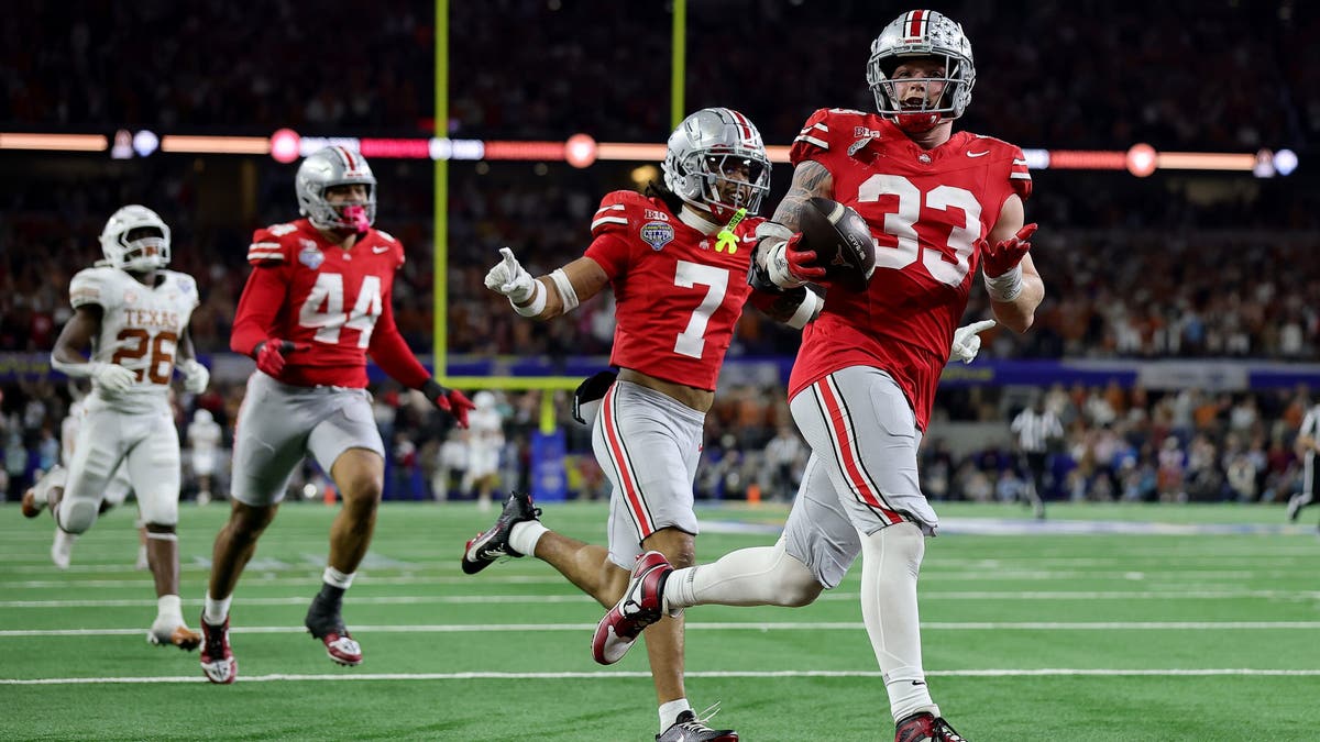 Jack Sawyer #33 of Ohio State scores a touchdown after recovering a fumble in the fourth quarter against Texas during the Goodyear Cotton Bowl. (Photo by Alex Slitz/Getty Images)