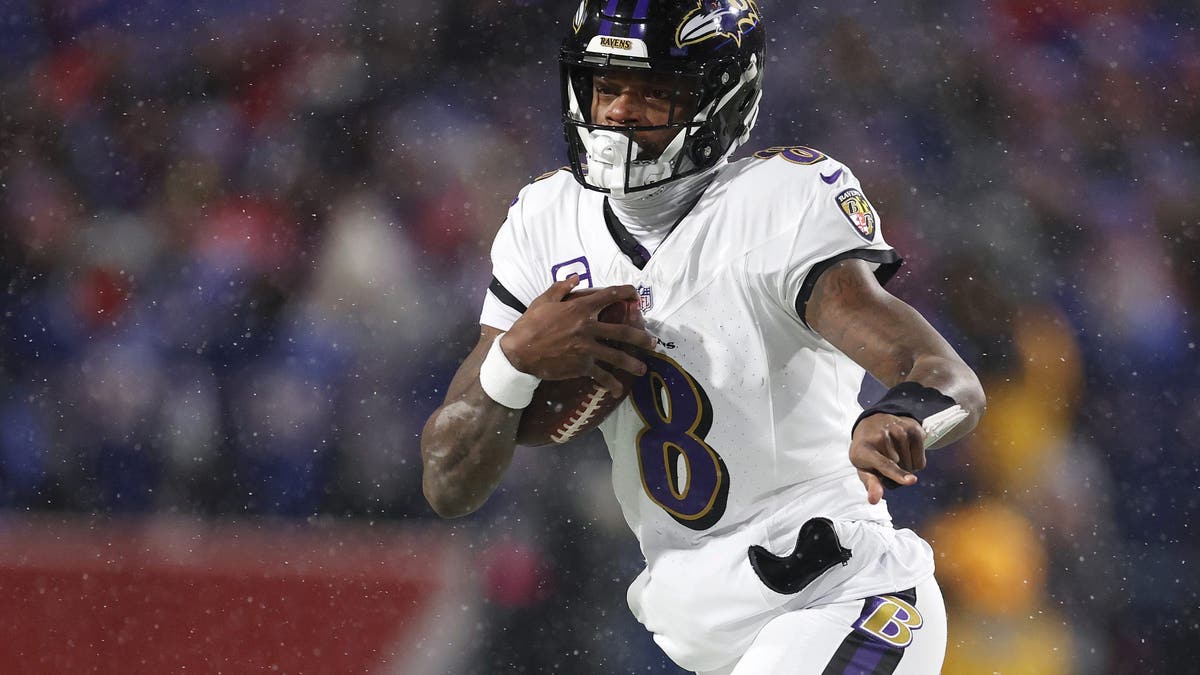Lamar Jackson is one of three quarterbacks who've won at least two MVPs currently playing in the NFL. (Photo by Al Bello/Getty Images)
