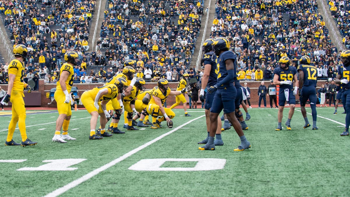 Players of the Michigan Maize team lineup against players of the Michigan Blue team during the first half of the Michigan Maize vs Blue Spring Football Game. (Photo by Aaron J. Thornton/Getty Images)