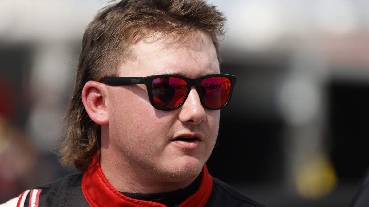 Brenden Queen talks with members of his crew during practice for the ARCA Menards Series General Tire 200 at Talladega 