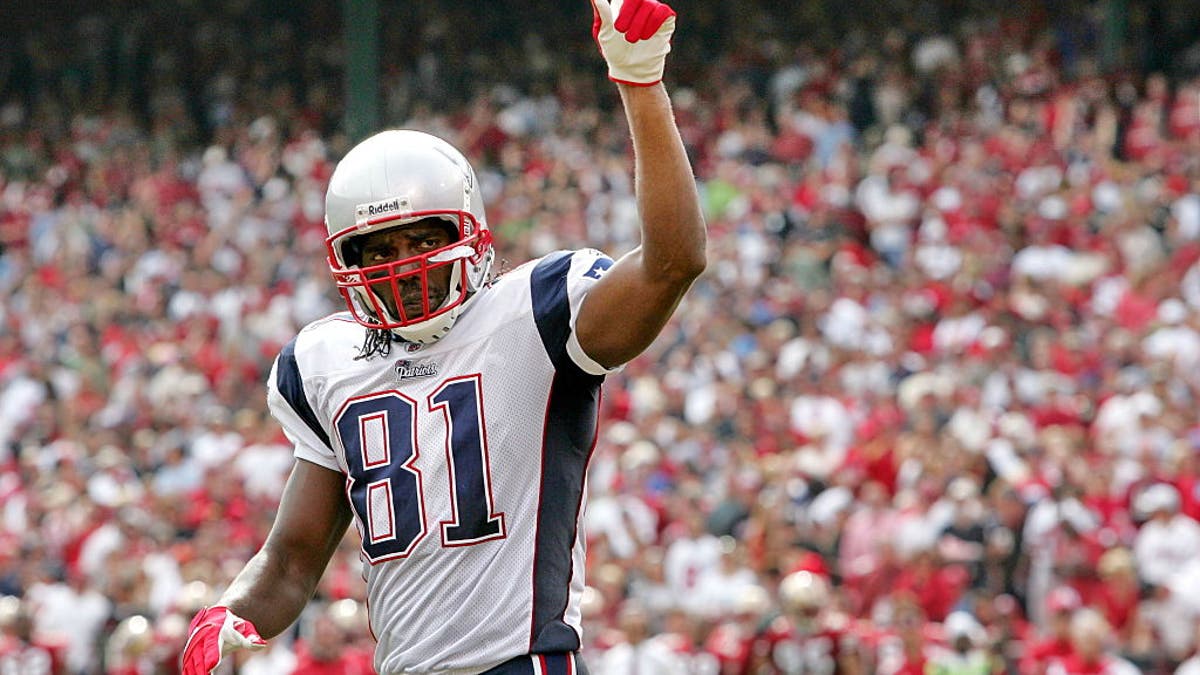 Randy Moss holds the record for most receiving touchdowns in a single season. (Photo by John Pyle/Getty Images)