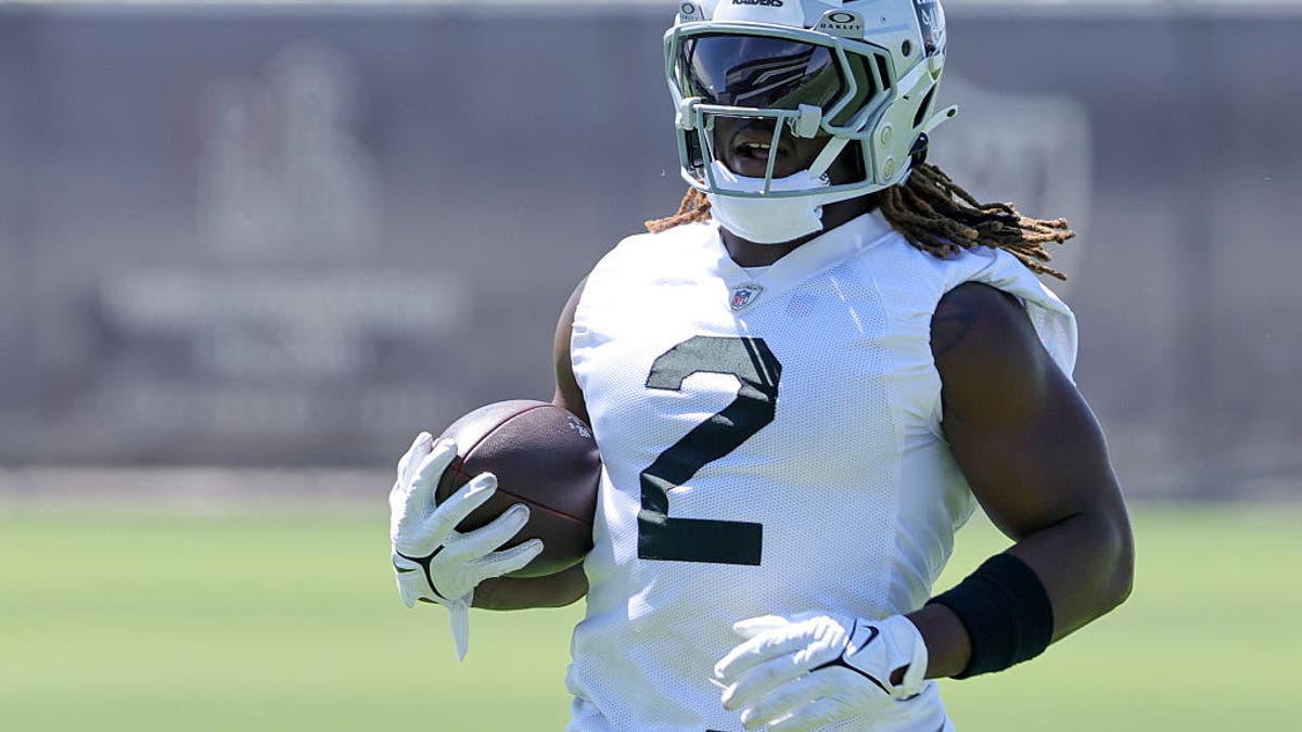 Ashton Jeanty #2 of the Las Vegas Raiders runs with the ball during an OTA offseason workout on May 29, 2025. (Photo by Ethan Miller/Getty Images)