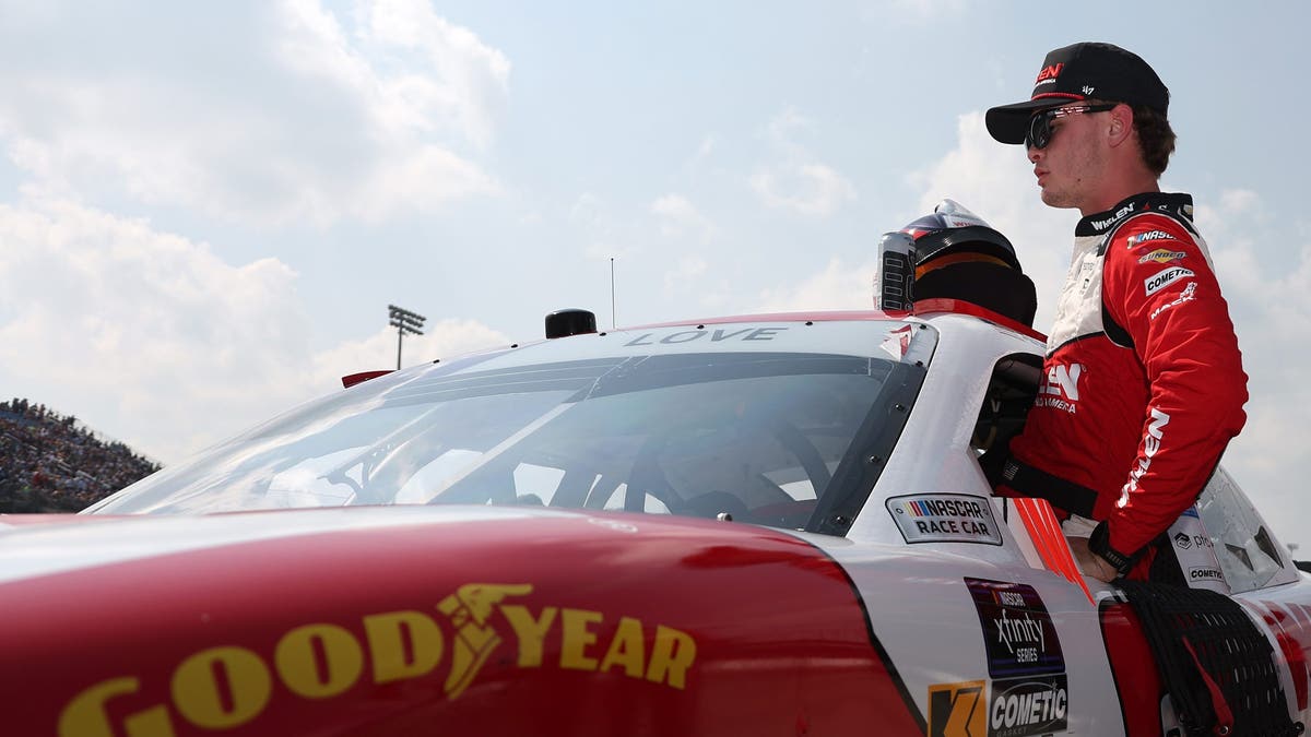 Jesse Love enters his car for the NASCAR Xfinity Series HyVee Perks 250 at Iowa Speedway