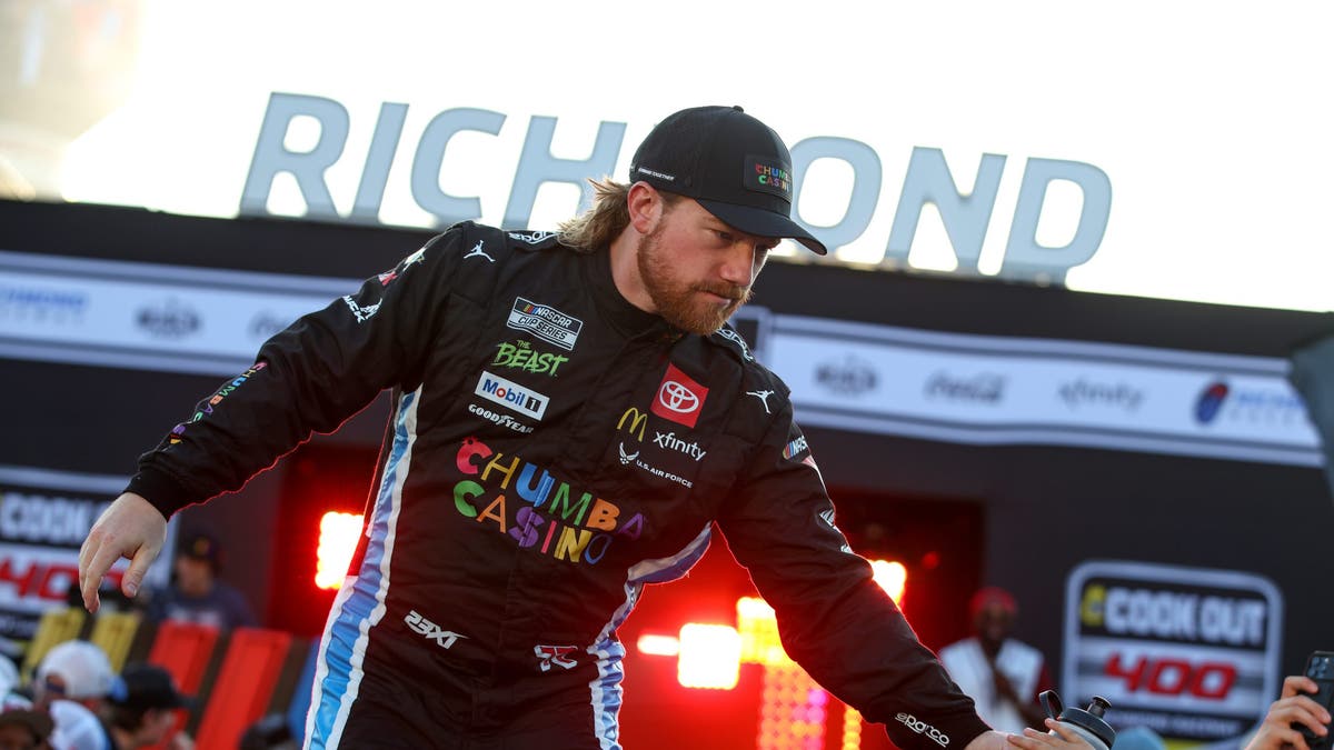 Tyler Reddick greets fans as he walks onstage during driver intros prior to the NASCAR Cup Series Cook Out 400 at Richmond.