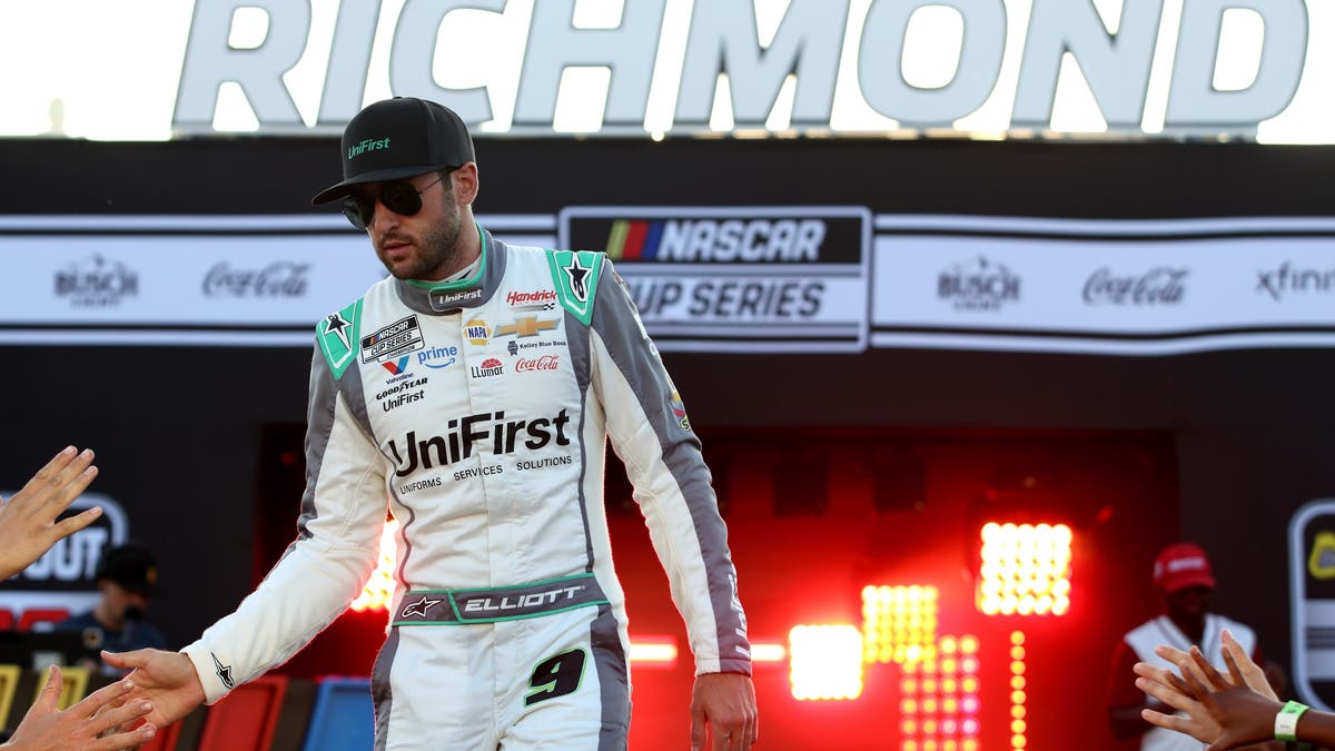 Chase Elliott greets fans as he walks on stage during driver intros prior to the NASCAR Cup Series Cook Out 400 at Richmond Raceway