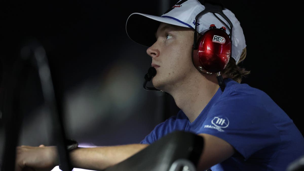 Connor Zilisch looks on from the pit box during the Xfinity Series race at Daytona.