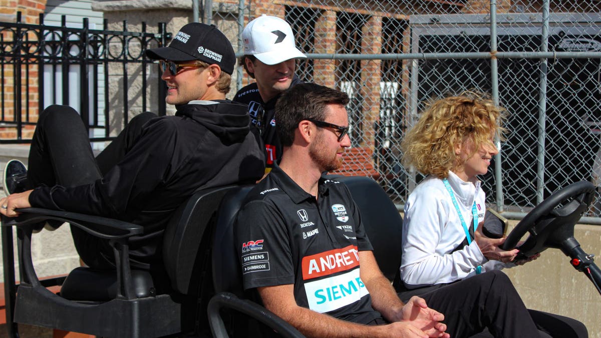 After the fan session, the Andretti Global drivers get a lift back to the garage from communications manager Michele Bates. Though they're not driving, Kirkwood and Colton Herta (white hat) keep their eyes on the wheel while Ericsson holds on. (Photo by Ed McGregor/FOX Sports)