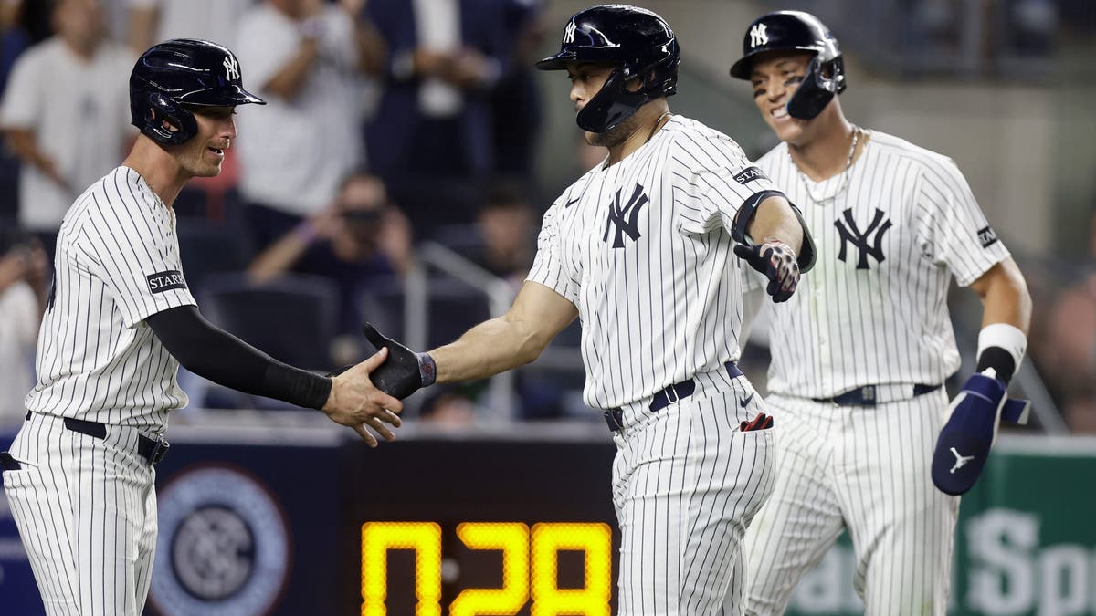 Quite a power trio. Giancarlo Stanton celebrates with Cody Bellinger with Aaron Judge looking along. (Photo by Jim McIsaac/Getty Images)