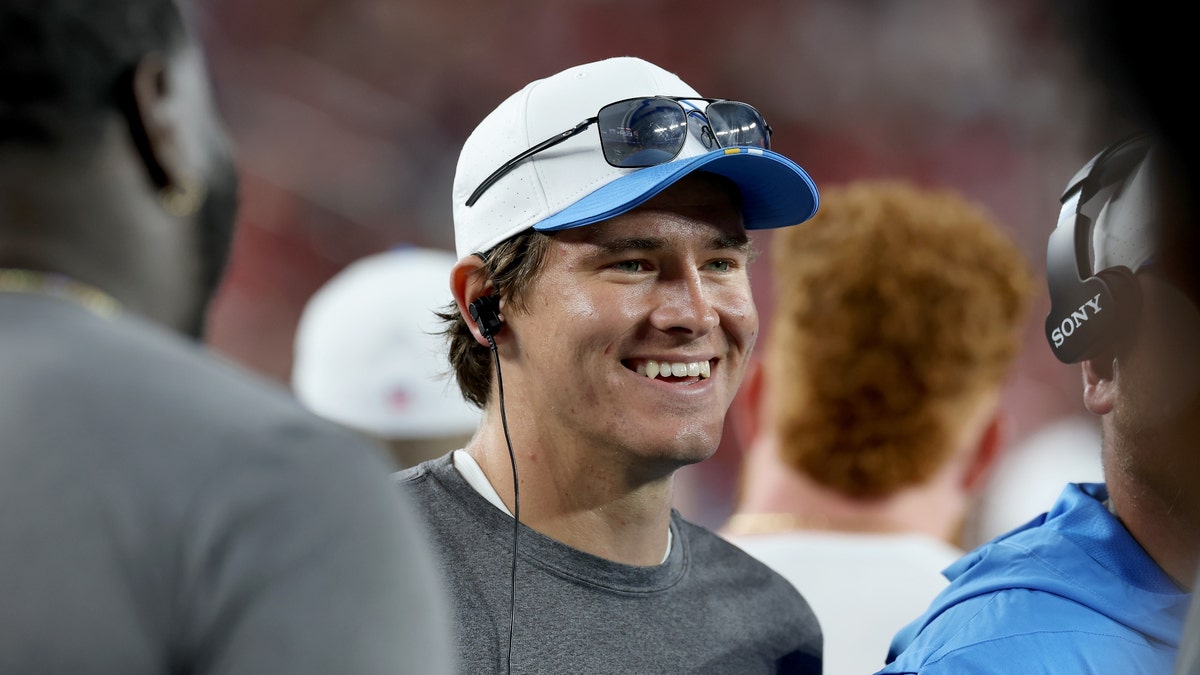 It's all smiles for Justin Herbert entering his second season under Jim Harbaugh. (Ezra Shaw/Getty Images)