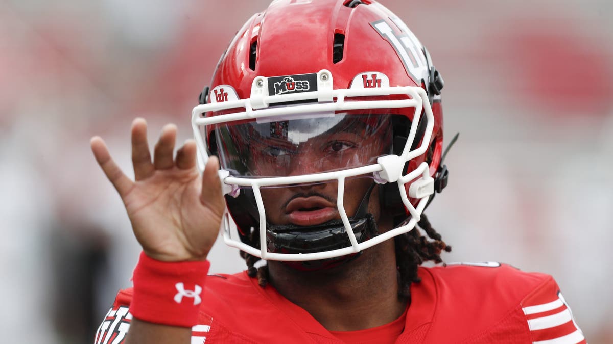 Devon Dampier #4 of the Utah Utes gestures during warm-ups before their game against the Cal Poly Mustangs. (Photo by Chris Gardner/Getty Images)