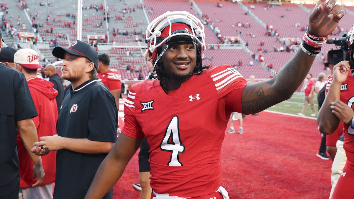 Devon Dampier #4 of the Utah Utes waves to fans as he leaves the field after their win against Cal Poly. (Photo by Chris Gardner/Getty Images)