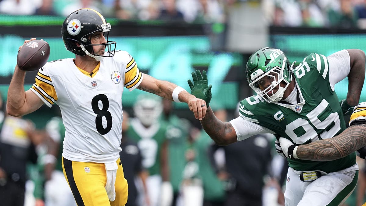 Aaron Rodgers is the first QB in 60 years to throw four touchdowns and 240 yards without an interception in a team debut. (Photo by Mitchell Leff/Getty Images)