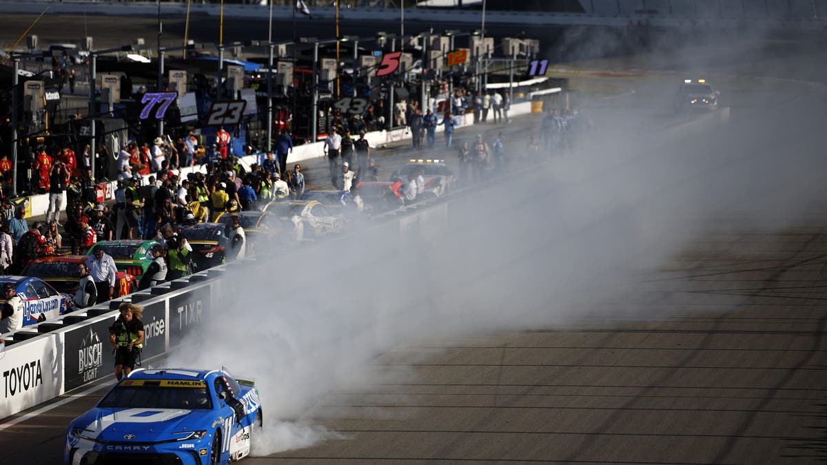 Hamlin celebrates with a burnout at the end of Sunday's Gateway race.