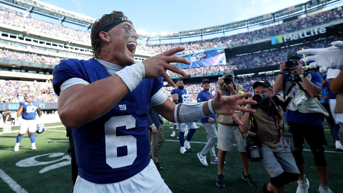 It was all smiles for Jaxson Dart after an upset win over the Chargers. (Ishika Samant/Getty Images)