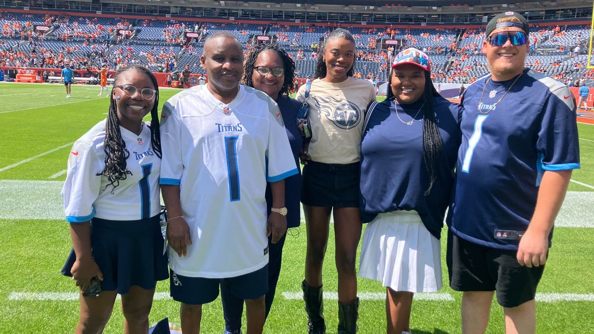 Calvin (No. 1) and Patrice (on Calvin's left) with the Cam Ward entourage before his NFL debut in Denver. (Photo by Ben Arthur)